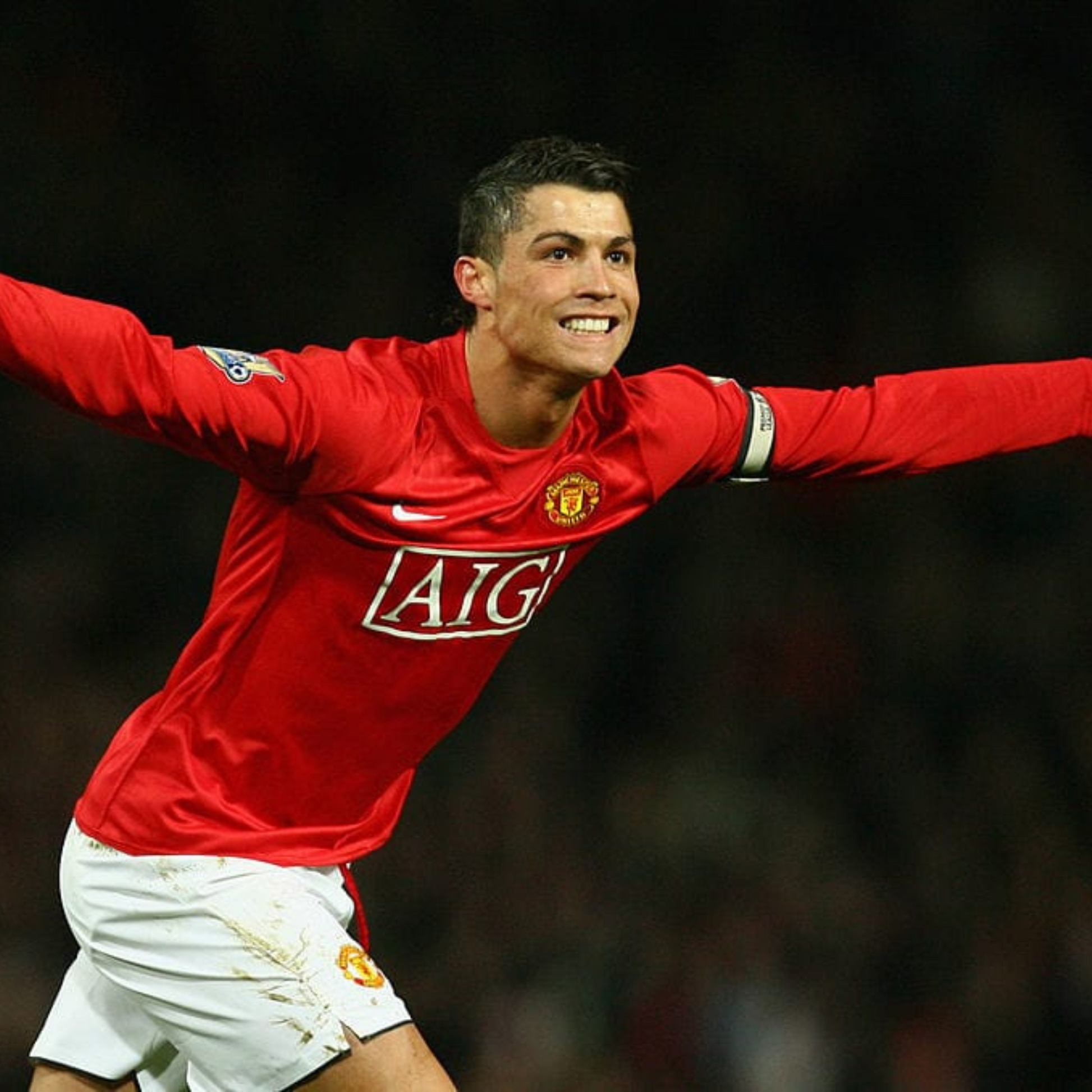 Portrait of Cristiano Ronaldo celebrating goal and wearing the 2007/2008 Champions League Manchester United Home Retro Soccer Jersey2008 Manchester United Jersey | MuchoGoal Kits