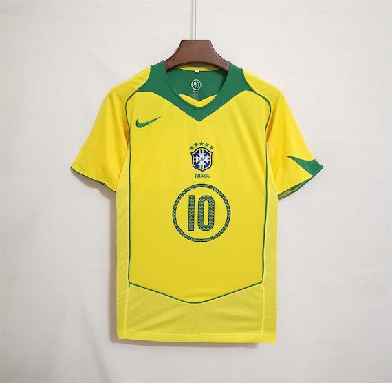 Front side view of the 2004 Copa America Retro Brazil Home Retro Soccer Jersey with number 102004 Brazil Jersey - Brazil Retro Soccer Jersey 2004 | MuchoGoal Kits